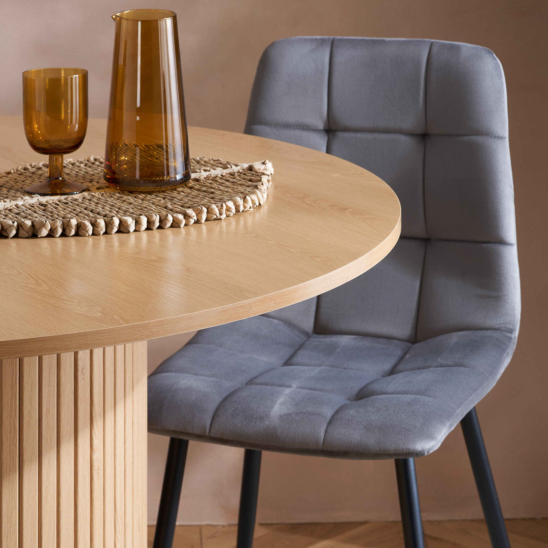 Axel Round Fluted Dining Table with Sculpted Pedestal Base and Textured Fluted Design