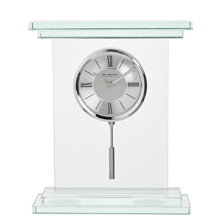Glass clock with silver face and stand on a white background