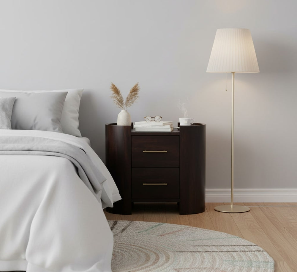 Modern bedroom with a bed, nightstand, and floor lamp.