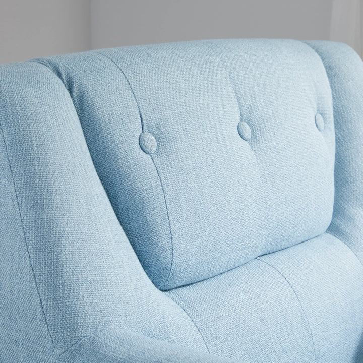 Light blue upholstered chair with button tufting on a neutral background