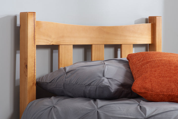 Elegant Pine Bed with Solid Slatted Base for Enhanced Stability