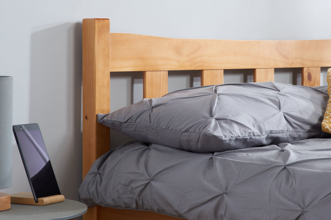 Elegant Pine Bed with Solid Slatted Base for Enhanced Stability