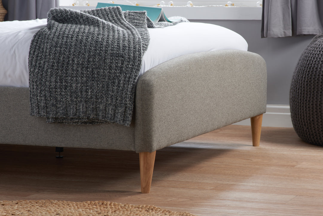 Quebec Upholstered Bed Frame with Gentle Curves and Soft Grey Fabric