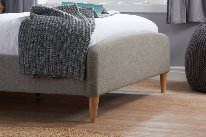 Quebec Upholstered Bed Frame with Gentle Curves and Soft Grey Fabric