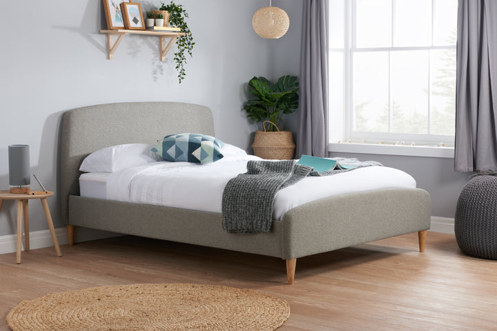 Quebec Upholstered Bed Frame with Gentle Curves and Soft Grey Fabric
