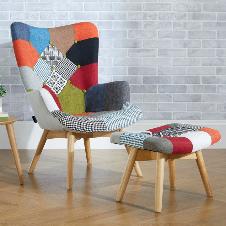 Colorful patchwork chair and ottoman with a small table against a brick wall.