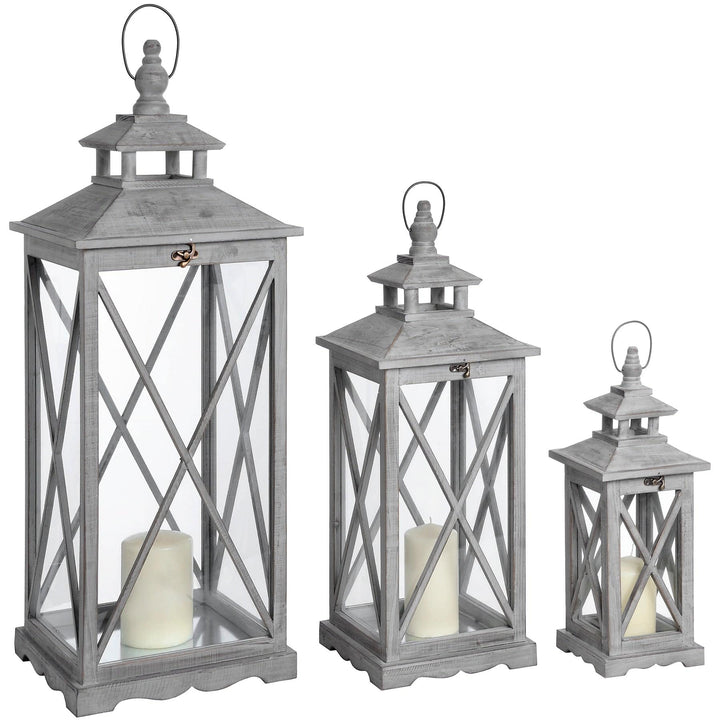 Set Of Three Wooden Lanterns With Traditional Cross Section - TidySpaces