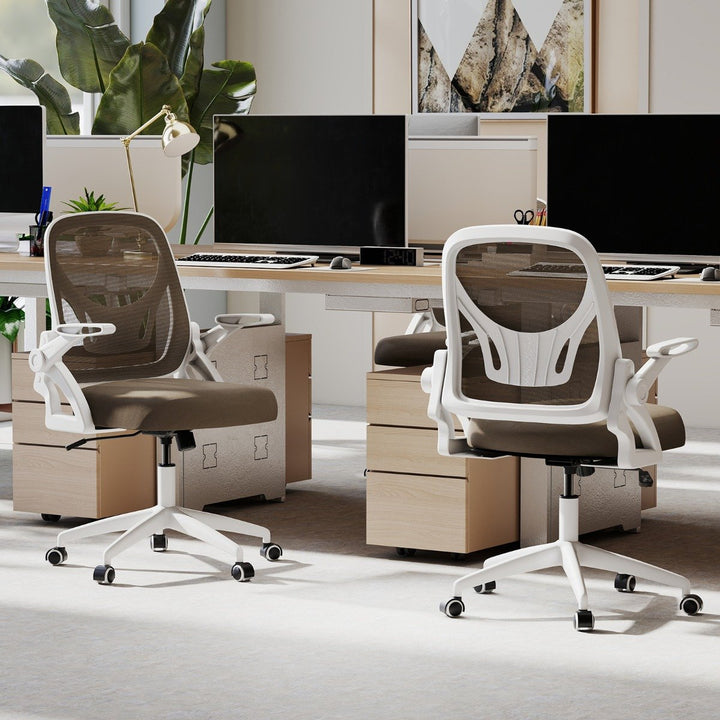 White ergonomic mesh office chair in contemporary office setting